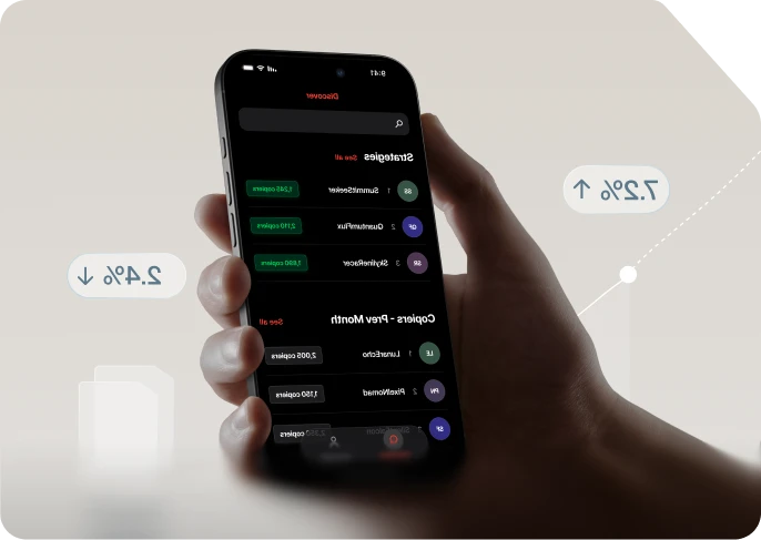 Hand holding a phone showing the Axi Copy Trading app