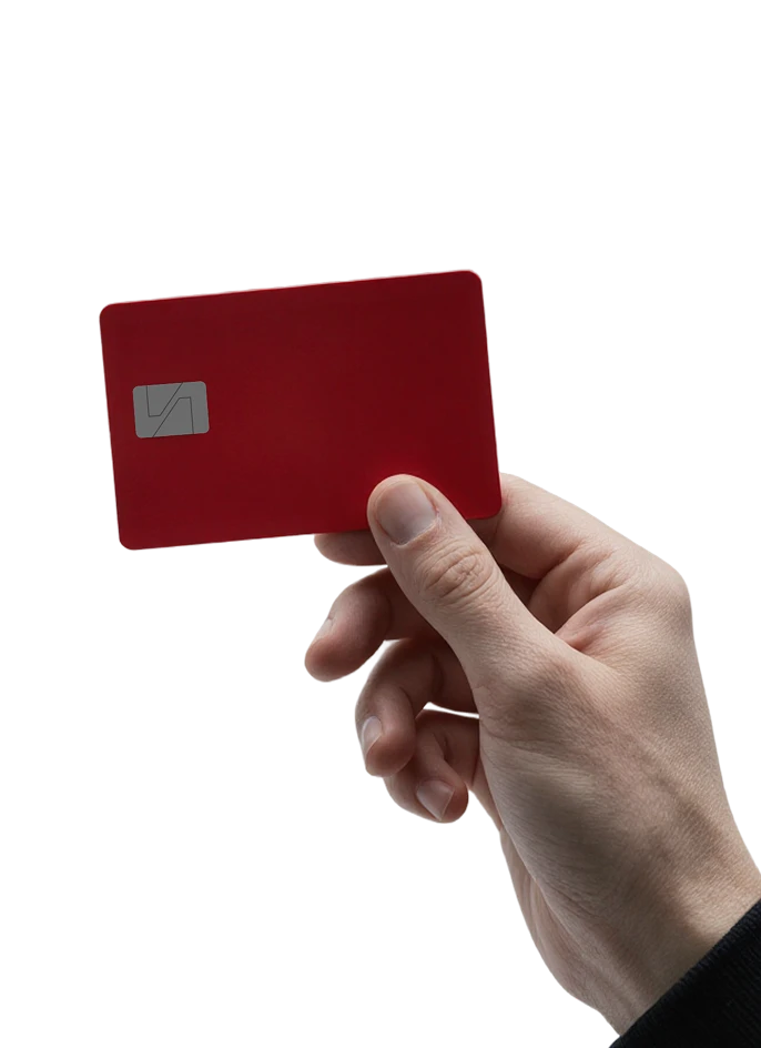 a hand holding a red credit card