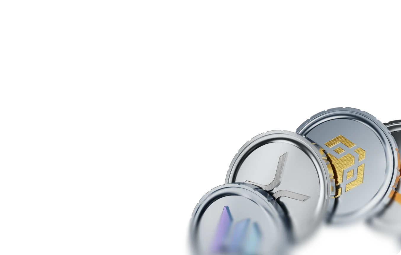 Silver and gold coins engraved with cryptocurrency symbols