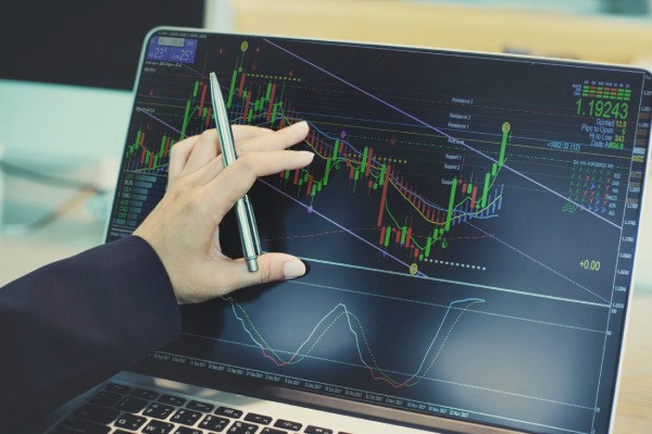 Laptop screen with technical indicators being used on a chart