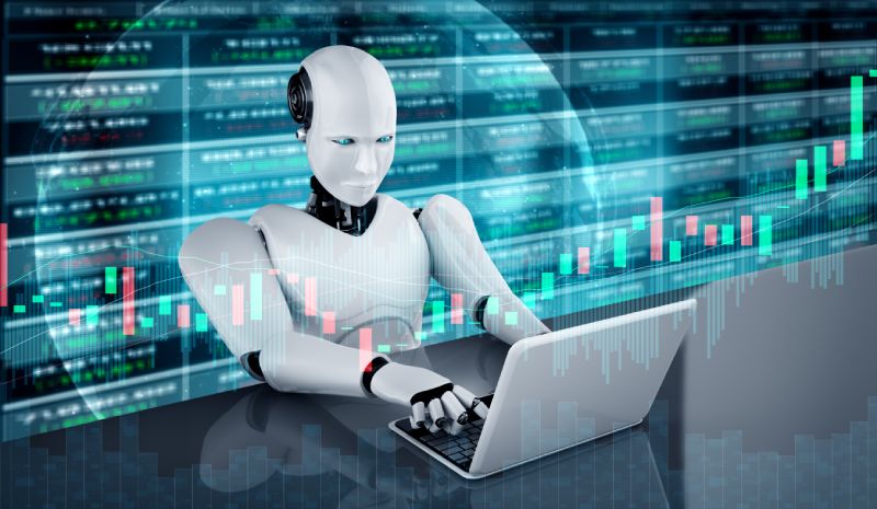 Robots trading on a laptop